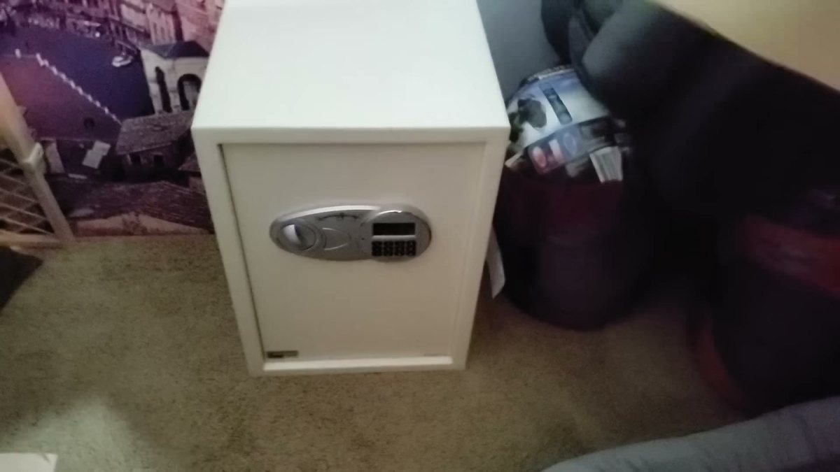 The safe hidden under the junk box